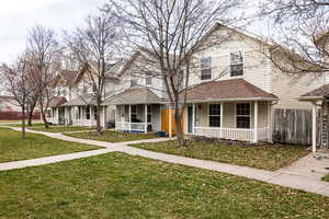 View of front facade featuring a porch and a shingled roof
