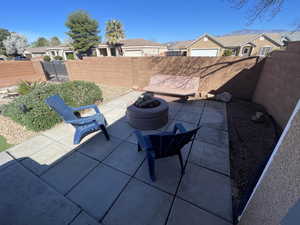 Fenced backyard with a residential view and a patio area
