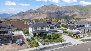 View of mountain backdrop featuring nearby suburban area