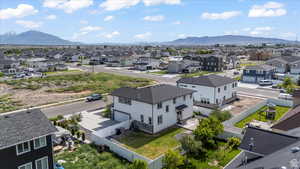 Aerial perspective of suburban area featuring a mountainous background