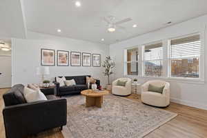 Living area featuring ceiling fan, light wood-type flooring, and recessed lighting