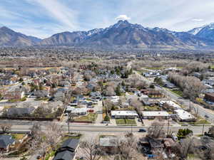 Aerial perspective of suburban area with a mountainous background