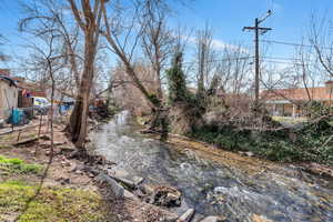 View of yard with a water view