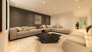 Living area with recessed lighting, light wood finished floors, and an accent wall