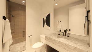 Full bathroom featuring vanity, a stall shower, and recessed lighting
