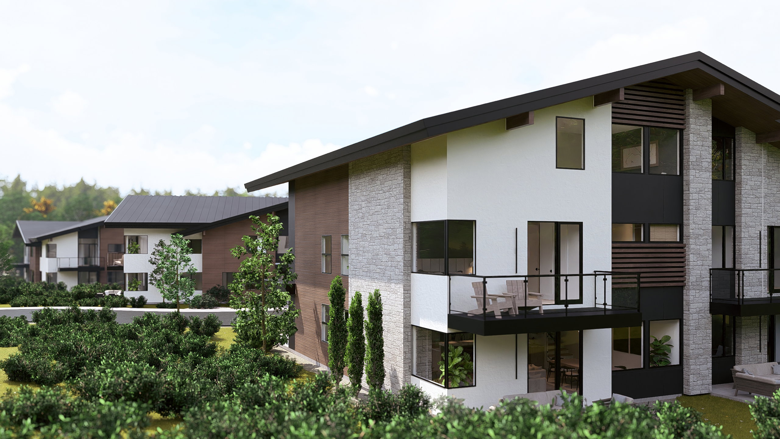 Back of house featuring a balcony and stucco siding