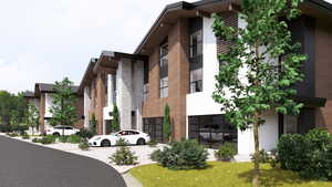 View of apartment building / complex with an attached garage and driveway