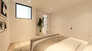 Bedroom featuring wood finished floors and recessed lighting