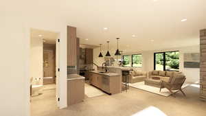 Kitchen with a breakfast bar area, a spacious island, open floor plan, pendant lighting, and dishwashing machine