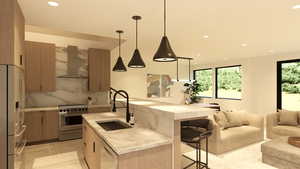 Kitchen with modern cabinets, a breakfast bar, stainless steel appliances, and open floor plan