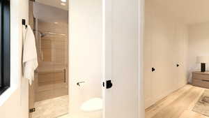 Bathroom featuring toilet and tiled shower