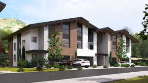 View of front of house featuring stucco siding