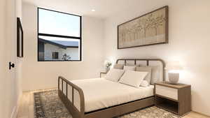 Bedroom with light wood-style floors