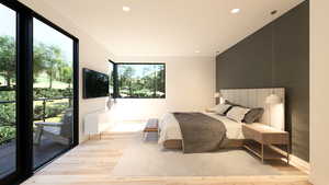 Bedroom featuring light wood-type flooring, recessed lighting, and access to outside