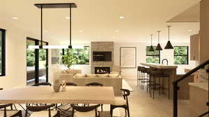 Dining space featuring a stone fireplace and recessed lighting