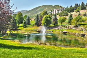 Surrounding community featuring a water and mountain view