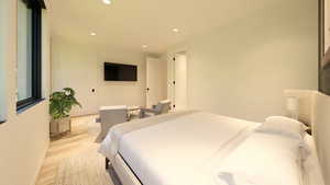 Bedroom featuring light wood-type flooring and recessed lighting