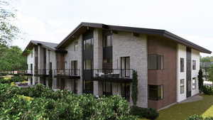 Rear view of house featuring a balcony