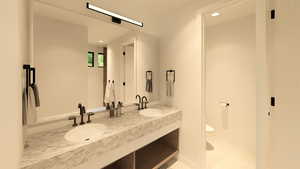 Bathroom with double vanity and recessed lighting