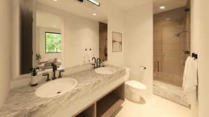 Bathroom featuring double vanity, a shower stall, and recessed lighting