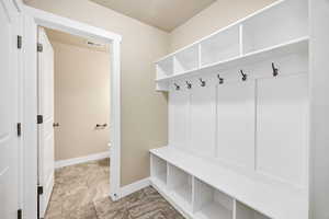 Mudroom featuring baseboards