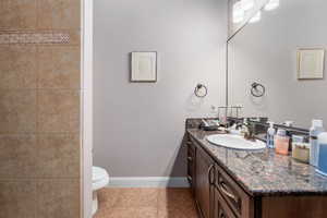 Bathroom featuring vanity and light tile patterned floors