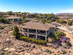 Aerial perspective of suburban area featuring a mountainous background