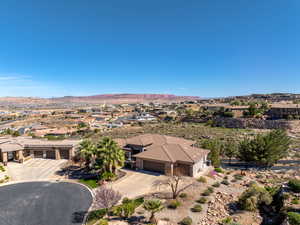 Aerial perspective of suburban area featuring a mountainous background