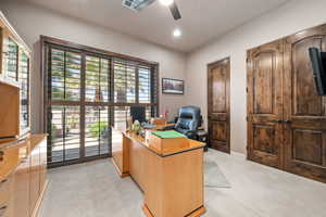 Office with light carpet, ceiling fan, and recessed lighting
