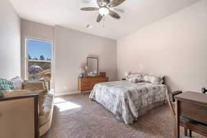 Bedroom with carpet flooring and ceiling fan