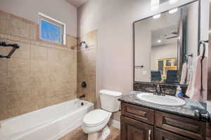 Bathroom featuring vanity and bathtub / shower combination