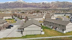 Aerial perspective of suburban area featuring a mountainous background