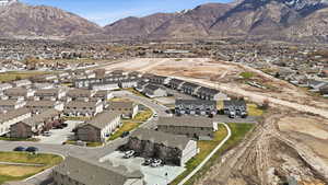 Aerial view of property's location featuring nearby suburban area and a mountain backdrop