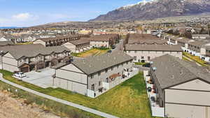 Aerial view of residential area featuring a mountainous background
