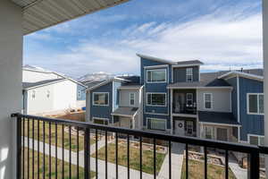 Balcony with a residential view and a mountain view