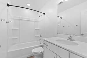 Bathroom featuring vanity and shower / bath combination