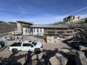 View of front of house featuring a metal roof