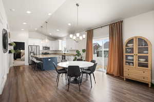 Dining area, luxury vinyl flooring LVP, and vaulted ceilings