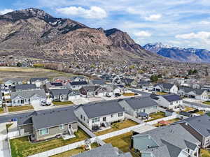 Aerial view of residential area featuring a mountain backdrop