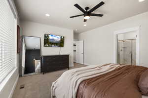 Large Primary bedroom on the main floor, recessed lighting, a ceiling fan, and ensuite bath