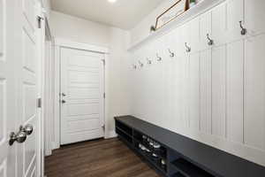 Mudroom with dark wood-style flooring