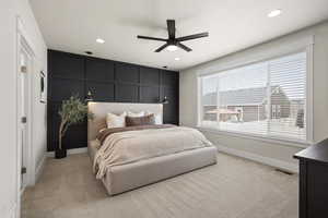 Large Primary bedroom on the main floor. Custom accent wall with reading light pendants.