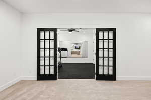 Glass French doors leading to the home gym!