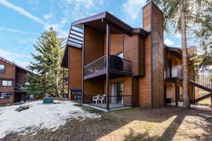 Rear view of house featuring a balcony