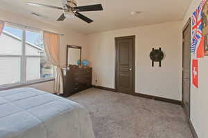 Bedroom featuring carpet and a ceiling fan
