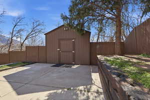 View of shed featuring a fenced backyard