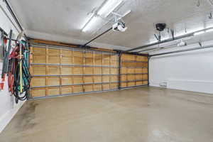 Garage featuring a garage door opener