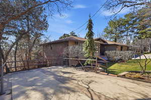 View of home's exterior featuring a yard and stucco siding