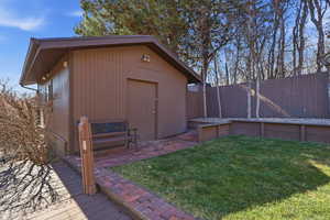 View of outbuilding with a fenced backyard