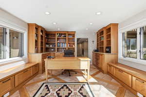Office space with recessed lighting, inlaid floor details, and light tile patterned flooring
